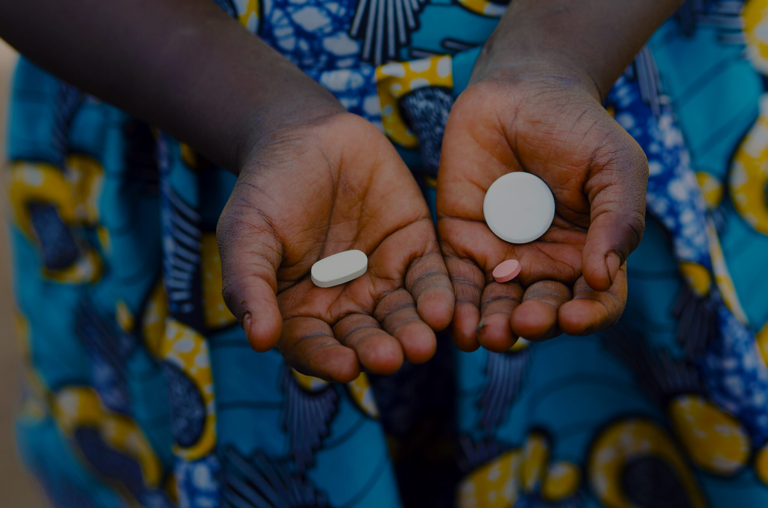 African Black Child Showing Pills as Medicine in Mali